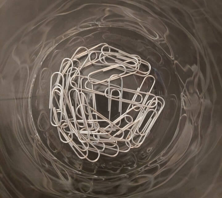 top view of a jar which has paperclips in it